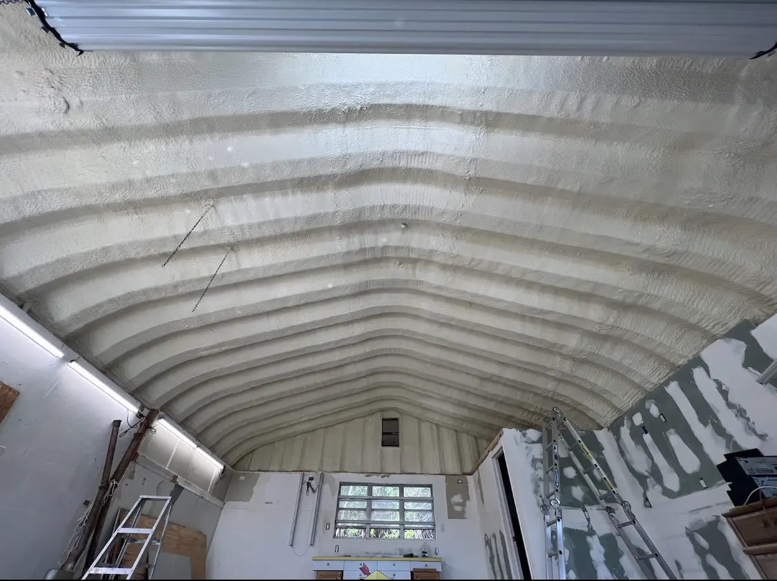 Spray polyurethane foam applied to the underside of a metal roof deck in Braintree Town